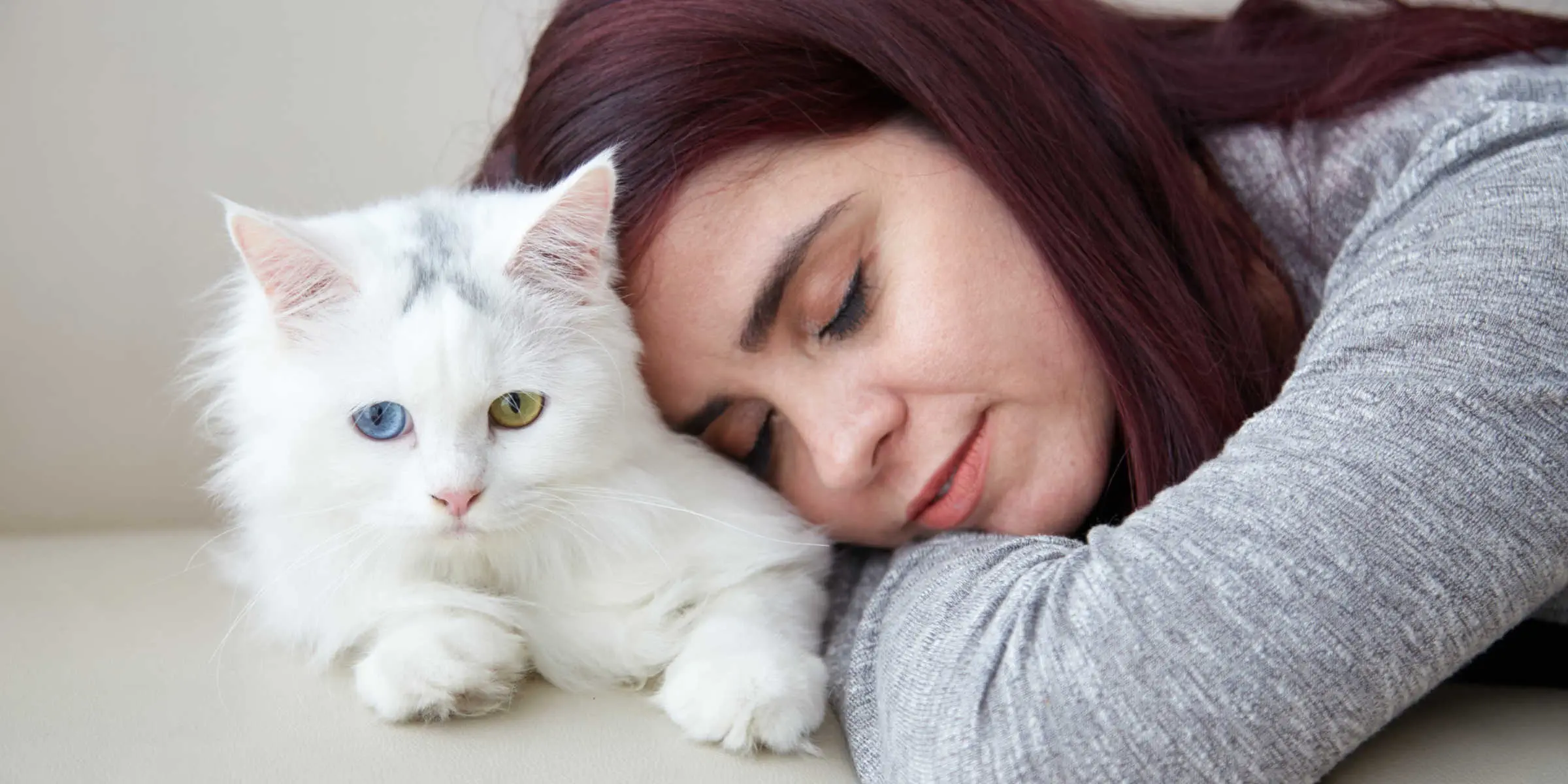 sleeping on a cat